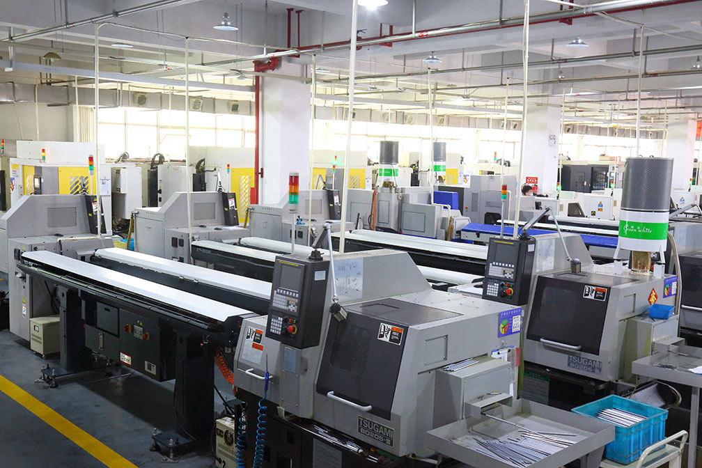 Bepto Pneumatic assembly workshop with pneumatic components being prepared