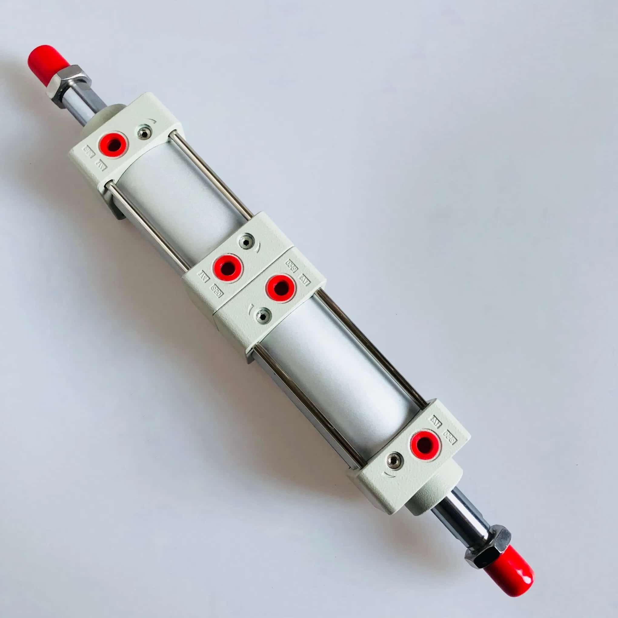 Two pneumatic cylinders mounted back-to-back for a three-position actuator arrangement.