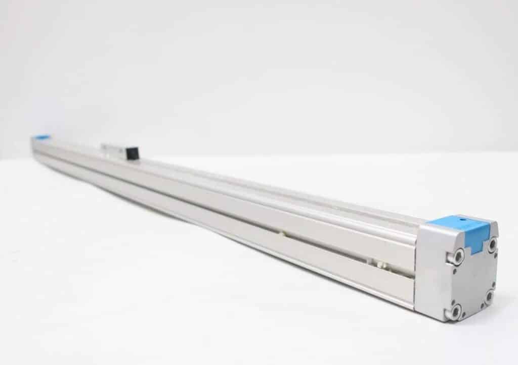 Legacy rodless pneumatic cylinder photographed for identification before replacement sourcing.