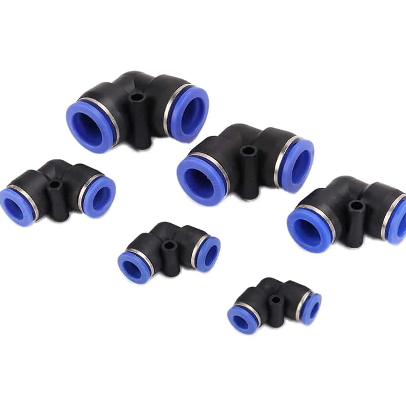 Pneumatic union elbow fitting illustrating how routing and local restrictions form part of the valve-to-actuator flow path.